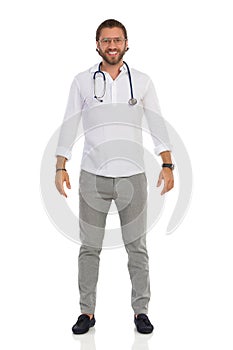 Smiling Handsome Male Doctor Is Standing Relaxed. Front View