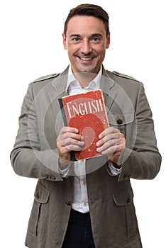 Smiling handsome man holds English textbook