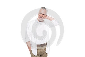 Smiling handsome mature man posing with hand behind head and looking away