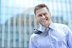 Smiling handsome young businessman