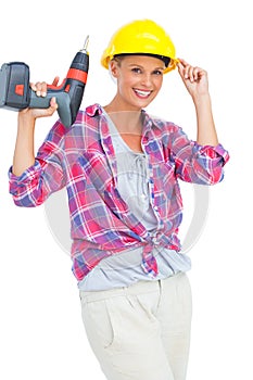 Smiling handy woman holding a power drill