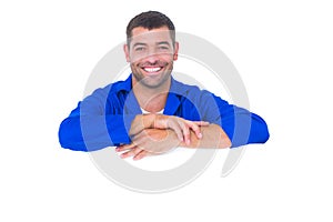 Smiling handyman with blank billboard