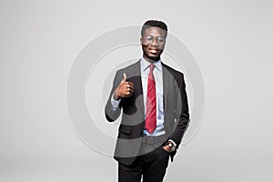 Smiling happy african black executive professional giving a thumbs up in studio
