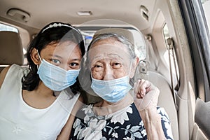 Smiling and Happy Asian Teen Girl and Grandma in Car