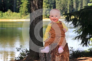 Smiling Happy Baby on Stump