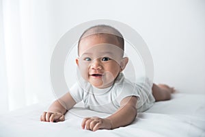 smiling happy baby tummy time