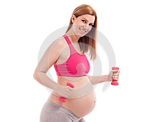 Smiling happy beautiful pregnant woman exercise