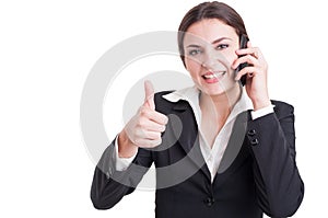 Smiling happy business woman showing like or thumb-up gesture