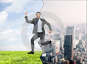 Smiling happy businessman jumping