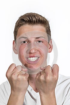 Smiling happy  caucasian teenage boy in studio