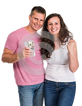Smiling happy couple holding dollar cash money