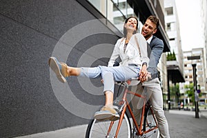 Smiling happy couple in love having fun together outdoors