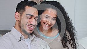 Smiling happy family Multiethnic Indian Hispanic married couple boyfriend and girlfriend bearded man and woman cuddling