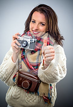 Smiling happy female photographer