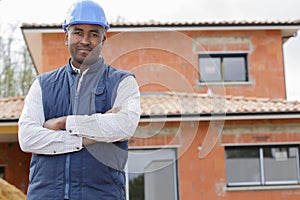 smiling happy handsome builder outdoors