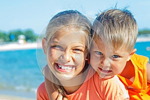 Smiling happy kids on the beach