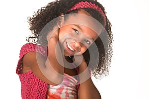 Smiling happy little girl with curly frizzy hair