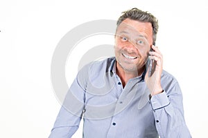 Smiling happy man talking on smartphone mobile phone isolated on white background