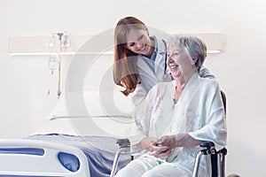 Smiling happy senior woman in a wheelchair