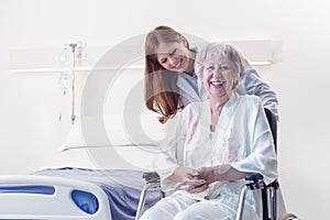 Smiling happy senior woman in a wheelchair