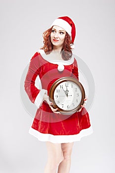 Smiling Happy Snow Maiden with Round Big Closk Showing Five Remaing Minutes To Christmas Against White Background
