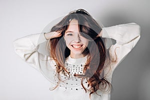 Smiling happy woman. Funny young girl on a white background. Sincere positive emotions