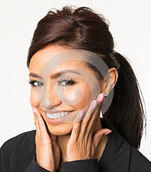 Smiling happy woman with hands on face