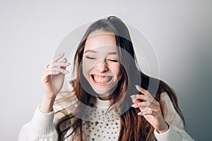 Smiling happy woman. Young beautiful girl laughing with eyes closed.