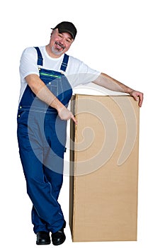 Smiling happy worker pointing to a cardboard box