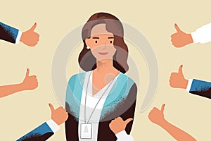 Smiling happy young woman surrounded by hands with thumbs up. Concept of public approval, acknowledgment, recognition photo