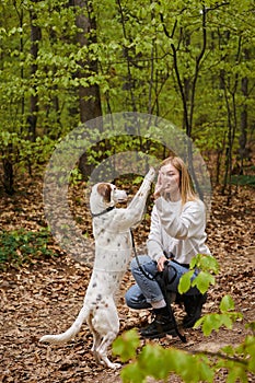 Smiling hiker woman with her pet