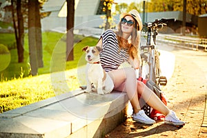 Smiling Hipster Girl with her Dog and Bike