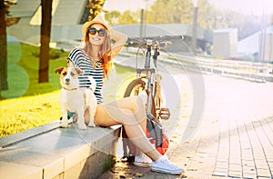 Smiling Hipster Girl with her Dog in Summer City