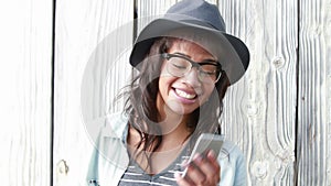 Smiling hipster woman phoning