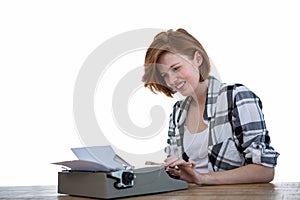 smiling hipster woman typing on her typewriter