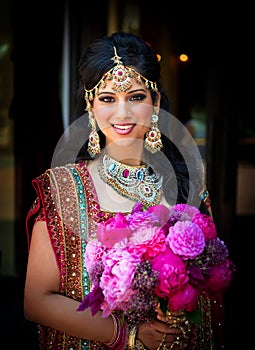 Smiling Indian Bride with Bouquet photo