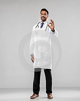 Smiling indian male doctor showing ok gesture