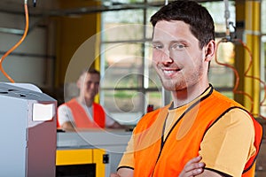 Smiling industrial worker at factory