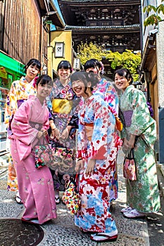 Smiling Japanese girls wearing traditional kimono