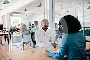 Smiling job applicant answering questions during an office interview