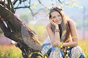 Smiling and joyful woman in spring meadow