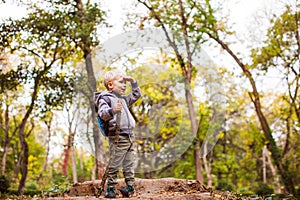 Smiling kid during autumn adventure in park