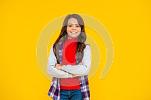 smiling kid in casual clothes on yellow background. happy childhood.