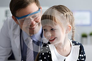 Smiling kid with doc photo