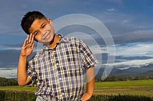 Smiling kid with a hand salute