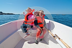 Smiling kids on the boat