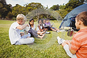 Smiling kids lying on the grass together