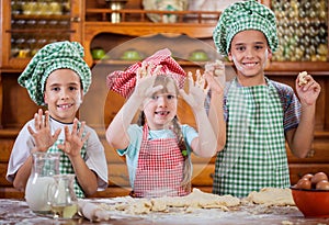 Smiling kids make a mess in the kitchen