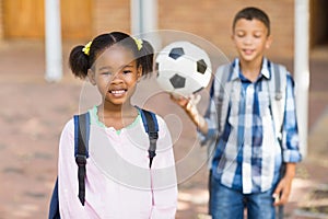 Smiling kids standing in at school