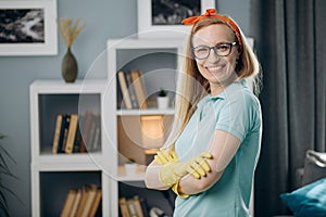 Smiling lady posing on camera in protective rubber gloves